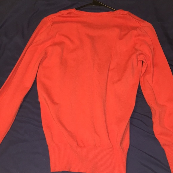orange cardigan/sweater. - Picture 2 of 3